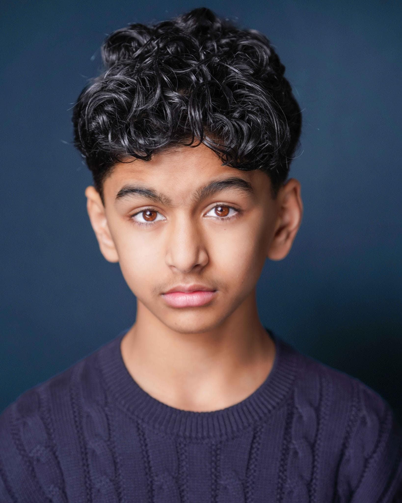 Tanay Joshi professional headshot on blue background